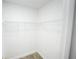 A spacious closet with white walls and a wire shelf for ample storage at 14308 Abington Heights Dr, Orlando, FL 32828