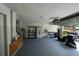 Spacious garage with painted flooring and ample storage, ready for vehicles and projects at 14308 Abington Heights Dr, Orlando, FL 32828