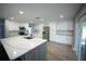 Bright kitchen with stainless steel appliances and a large island at 14308 Abington Heights Dr, Orlando, FL 32828