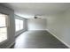 Large, empty living room with hard floors and a ceiling fan at 14308 Abington Heights Dr, Orlando, FL 32828