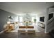 Bright and open living room with wood floors, comfortable seating, and stylish decor at 14308 Abington Heights Dr, Orlando, FL 32828