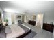Spacious main bedroom with wood-look floors and ensuite bathroom at 14308 Abington Heights Dr, Orlando, FL 32828