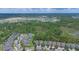 Extensive aerial view showcases a community near a conservation area at 1529 Chelsea Manor Cir, Deland, FL 32724