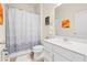 Bright bathroom featuring a white vanity, modern fixtures, and decorative shower curtain at 1529 Chelsea Manor Cir, Deland, FL 32724