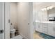Spacious bathroom featuring double sinks, a glass shower, and modern fixtures at 1529 Chelsea Manor Cir, Deland, FL 32724