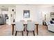 Bright dining area with tile flooring and view of the kitchen and living spaces at 1529 Chelsea Manor Cir, Deland, FL 32724