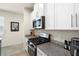 Kitchen with stainless steel appliances, light countertops, and bright modern cabinetry at 1529 Chelsea Manor Cir, Deland, FL 32724