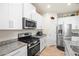 Well-equipped kitchen featuring stainless steel appliances and ample counter space at 1529 Chelsea Manor Cir, Deland, FL 32724
