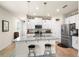 Bright kitchen with stainless steel appliances, breakfast bar, and modern cabinets at 1529 Chelsea Manor Cir, Deland, FL 32724