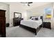 Comfortable bedroom with neutral carpet, ceiling fan, and lots of natural light at 1529 Chelsea Manor Cir, Deland, FL 32724
