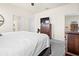 Primary bedroom featuring a tv, ensuite bathrooms, dresser and king bed at 1529 Chelsea Manor Cir, Deland, FL 32724