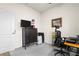 Office space with desk, chair, television, and storage cabinet at 1529 Chelsea Manor Cir, Deland, FL 32724