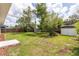 Wide view of the expansive backyard showing the storage sheds at 1801 Palm Ln, Orlando, FL 32803