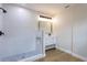 Modern bathroom featuring a glass-enclosed shower with white tile and a vanity with a large mirror at 1801 Palm Ln, Orlando, FL 32803