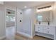 Modern bathroom featuring a glass-enclosed shower with white tile and a double sink vanity with a large mirror at 1801 Palm Ln, Orlando, FL 32803