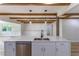 Bright kitchen island featuring a stainless steel dishwasher and modern faucet at 1801 Palm Ln, Orlando, FL 32803