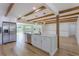 Bright open kitchen with stainless appliances and large kitchen island and light wood flooring at 1801 Palm Ln, Orlando, FL 32803