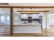 Open concept kitchen with white cabinetry, subway tile backsplash, and stainless appliances at 1801 Palm Ln, Orlando, FL 32803