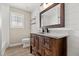 Bathroom featuring vanity with marble countertops, wood-look tile floors, and shiplap walls at 1815 Big Oak Ln, Kissimmee, FL 34746