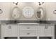 Bright bathroom featuring double vanity, framed mirrors, and stylish sinks at 1815 Big Oak Ln, Kissimmee, FL 34746