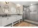 Bright bathroom featuring double vanity, walk-in shower with tiled walls and floors at 1815 Big Oak Ln, Kissimmee, FL 34746