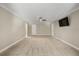 A spacious bedroom features neutral tones, and doors to other rooms at 1815 Big Oak Ln, Kissimmee, FL 34746