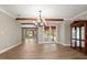 Dining room featuring wood-look floors and view of backyard at 1815 Big Oak Ln, Kissimmee, FL 34746