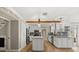 Bright and airy kitchen features an island, stainless steel appliances, and stylish lighting at 1815 Big Oak Ln, Kissimmee, FL 34746