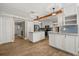 Bright and airy kitchen features an island, stainless steel appliances, and stylish lighting at 1815 Big Oak Ln, Kissimmee, FL 34746