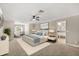 A spacious main bedroom features a ceiling fan, neutral tones, and access to the bathroom at 1815 Big Oak Ln, Kissimmee, FL 34746