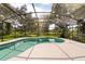 A screened in pool area and patio perfect for escaping the sun at 1815 Big Oak Ln, Kissimmee, FL 34746