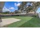 Large, grassy backyard featuring a patio, mature trees, and a fenced perimeter providing a private outdoor space at 1821 Geigel Ave, Orlando, FL 32806