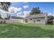 A beautifully maintained lawn and full fencing for a private backyard oasis with a concrete patio at 1821 Geigel Ave, Orlando, FL 32806