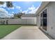 Spacious backyard featuring a concrete patio, a well-maintained lawn, and a privacy fence, perfect for outdoor living at 1821 Geigel Ave, Orlando, FL 32806