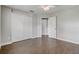 Bedroom with wood-look tile flooring, closet, and neutral paint at 1821 Geigel Ave, Orlando, FL 32806