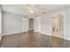 Bedroom with neutral walls and ceiling fan with access to ensuite bathroom at 1821 Geigel Ave, Orlando, FL 32806