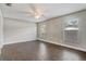Bright bedroom featuring wood-look tile flooring and two windows at 1821 Geigel Ave, Orlando, FL 32806