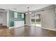 Dining room with backyard access through sliding glass door and built-in cabinets at 1821 Geigel Ave, Orlando, FL 32806