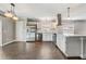 Bright eat-in kitchen with stainless steel appliances, tile backsplash and dark wood flooring at 1821 Geigel Ave, Orlando, FL 32806