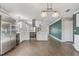 Bright, renovated kitchen featuring stainless steel appliances and wood-look tile flooring at 1821 Geigel Ave, Orlando, FL 32806