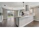 Open kitchen and dining area featuring stainless steel appliances and backyard view at 1821 Geigel Ave, Orlando, FL 32806