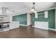 A kitchen with stainless steel appliances, white cabinets, and hard floors at 1821 Geigel Ave, Orlando, FL 32806