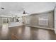 Spacious living room with modern lighting, hard floors, and a view into the kitchen at 1821 Geigel Ave, Orlando, FL 32806