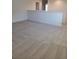 Upstairs bonus room with neutral carpet, white walls, and ample space for versatile use at 1855 Church Lake St, Groveland, FL 34736