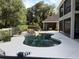 Relaxing backyard pool area with a cozy outdoor lounge and privacy fence at 1865 S Tanner Ct, Deltona, FL 32738