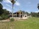 Expansive backyard featuring a covered porch and outdoor entertainment area at 1865 S Tanner Ct, Deltona, FL 32738