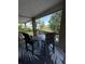 Enjoy outdoor living on the screened balcony with comfortable seating and peaceful lake views at 1865 S Tanner Ct, Deltona, FL 32738
