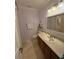 Bathroom with light purple walls, large mirror, and tile flooring at 1865 S Tanner Ct, Deltona, FL 32738