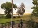 Beautiful lake view with trees and a black metal fence at 1865 S Tanner Ct, Deltona, FL 32738