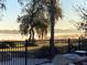 Peaceful lake view from the property, framed by lush greenery at 1865 S Tanner Ct, Deltona, FL 32738